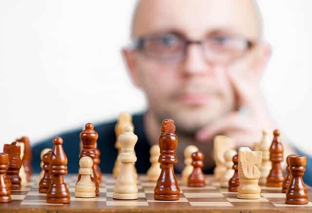 A man playing chess. Do market research for your ecommerce business.